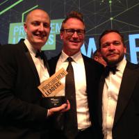Four celebrate award win with client Tesco